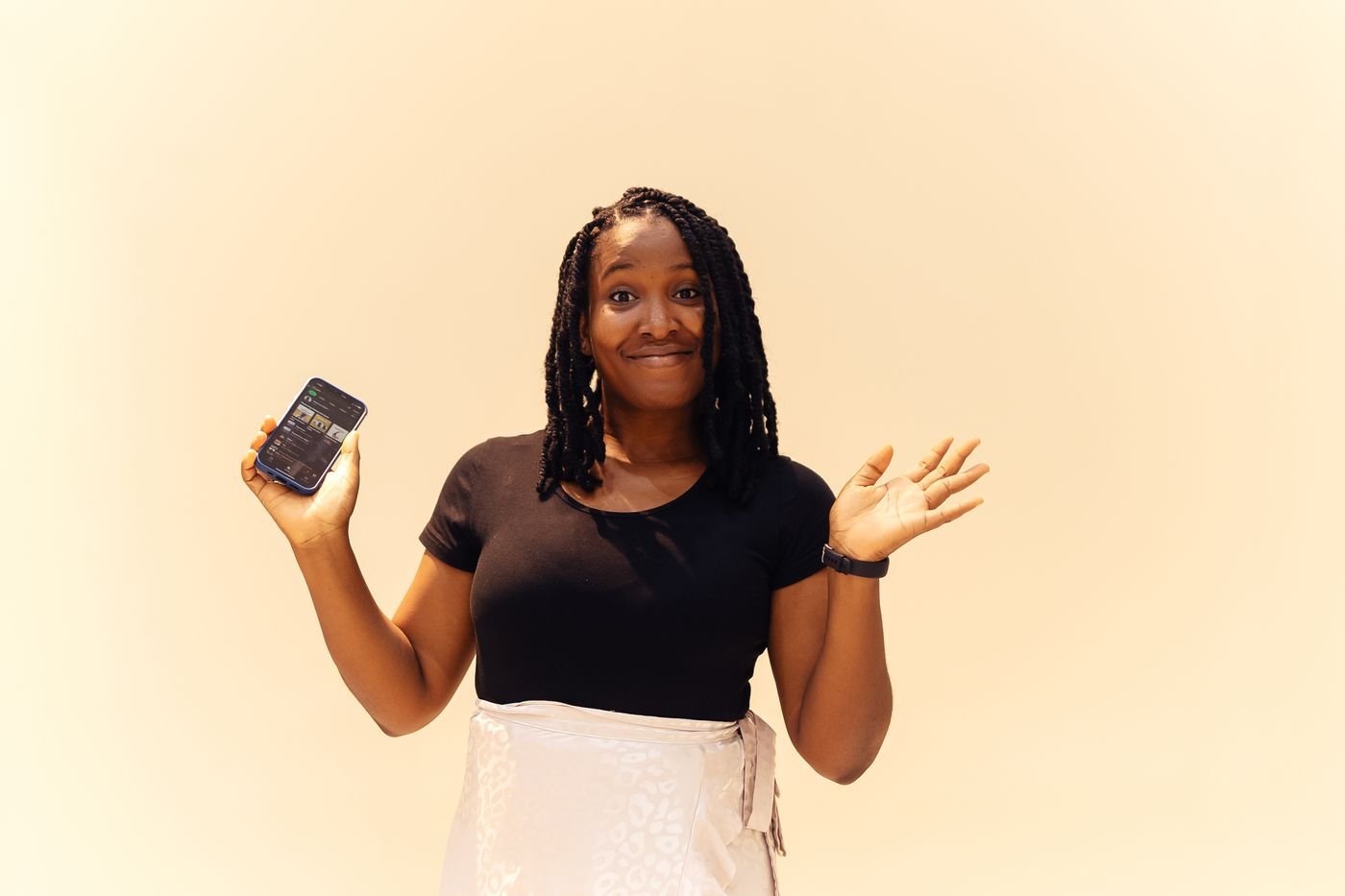A woman sending money home from her phone